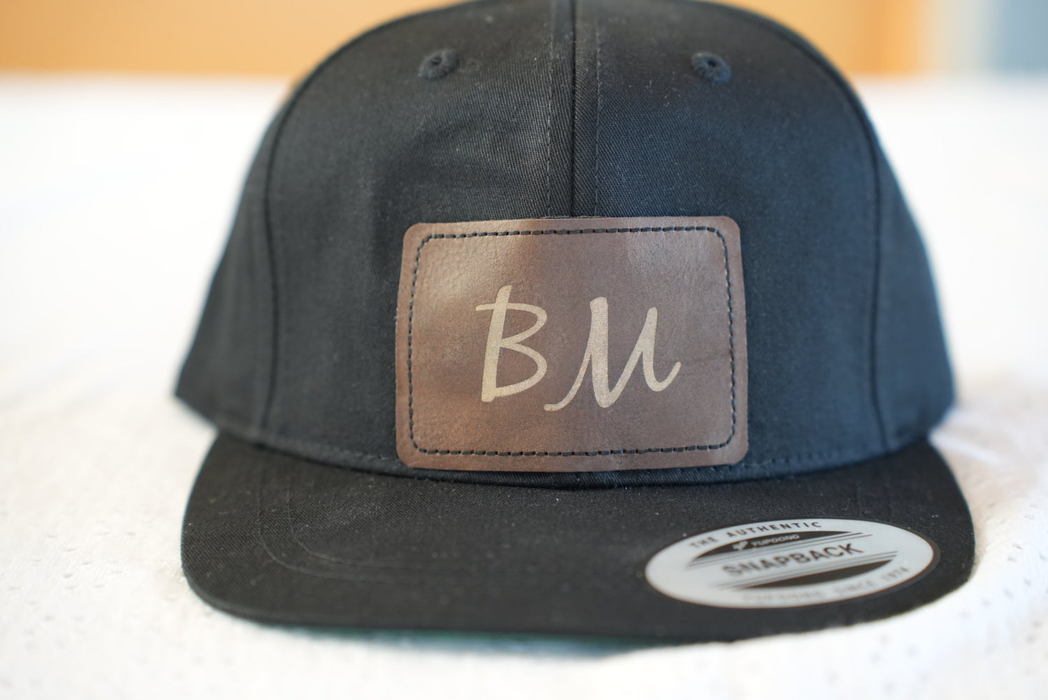 Snapback pet met je eigen initialen